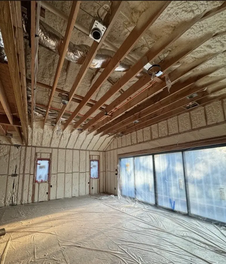 Interior walls and ceiling insulated with spray foam during new construction in Weare